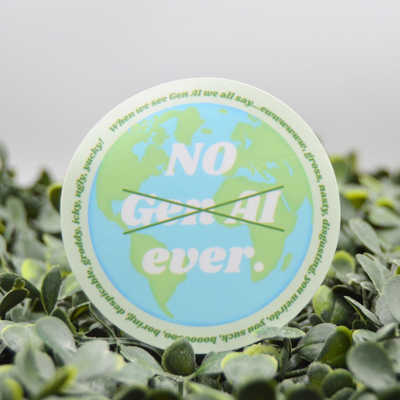 A circular sticker with a green and blue globe design and the text 'NO Gen. Al ever.