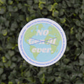 A circular sticker with a blue and green globe design and the text 'NO Gen AI ever.' crossed out with a blue X, shown against a background of green variegated foliage.